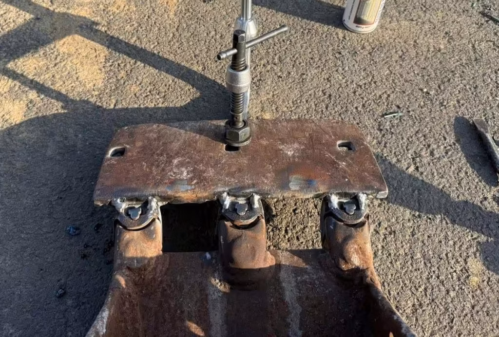 On Site Welding Services for Emergency Machinery Repairs | Eddy's Mobile Welding | On-Site Welding & Metal Fabrication in Sydney Close-up of the completed weld on an excavator bucket tooth repaired by Eddy’s Mobile Welding in Mona Vale